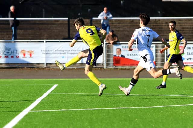 Matthew Paterson volleys Gosport  ahead at Merthyr. Picture by Tom Phillips