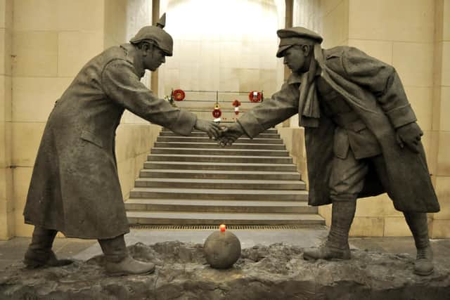 Andrew Edwards' Christmas Truce statue on temporary display at the Menin Gate, Ypres, Belgium