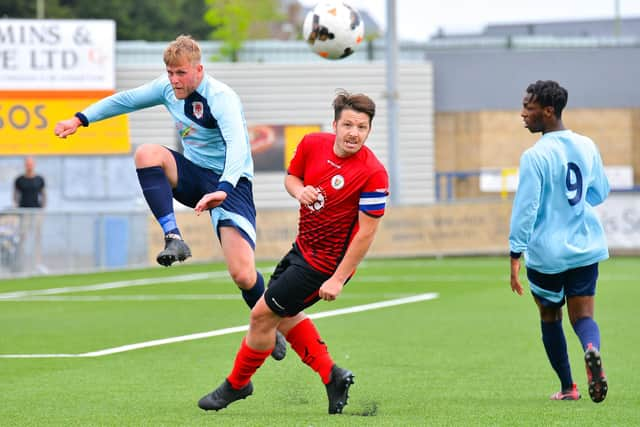 Jim Cuthbert (red) in cup final action at Westleigh Park. Picture: Martyn White.