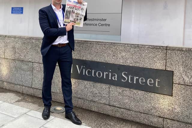 Former News reporter Tom Cotterill delivering a copy of the paper to Westminster to present to the Department for Business, Energy and Industrial Strategy in opposition to the Aquind interconnector plan in October last year, before Kwasi Kwarteng turned down the plan.