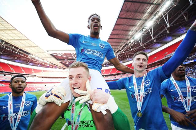 Jamal Lowe and Pompey team-mates bask in Checkatrade Trophy final glory at Wembley in March 2019. Picture: Joe Pepler