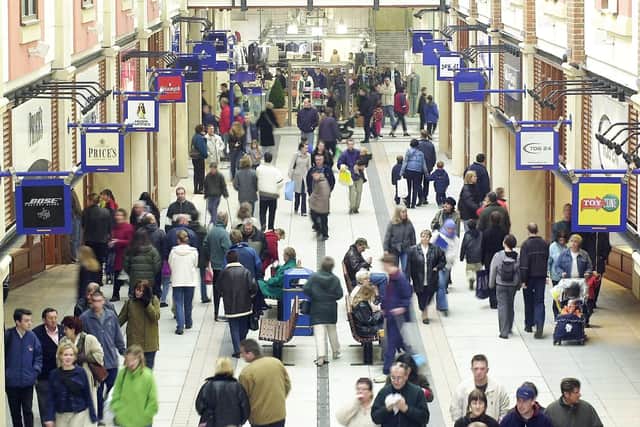 Crowds wander through Gunwharf Quays during the official opening in 2001.
Picture: Luke MacGregor