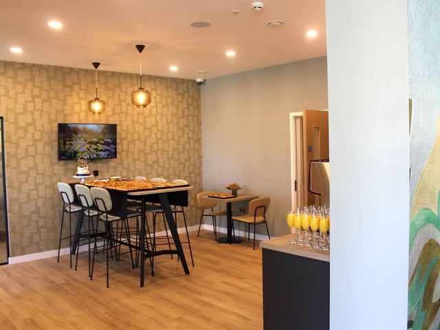 The new collaborative space offers clients a place to eat lunch, work in the pods, or accommodate waiting guests.
