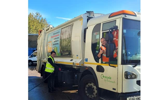 Cllr Dave Ashmore fills a bin lorry with HVO fuel with Biffa supervisor Michael Hobbs in the driver seat.