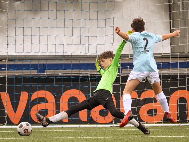 Action from the Portsmouth Youth League Geldard Invitation Cup final between Jubilee 77 U13s and Castle United U13s (light blue and white kit). Picture: Keith Woodland (190321-804)