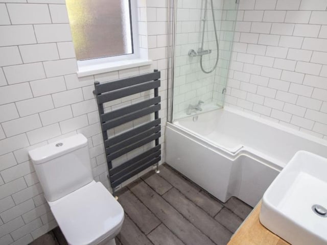 This property comes with three bedrooms, two bathrooms and a reception room as well as a garden and parking.