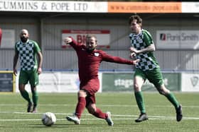 Burrfields' Craig Ball (maroon) in action during his side's Mid-Solent League loss to Mob Albion at Westleigh Park.
Picture: Allan Hutchings