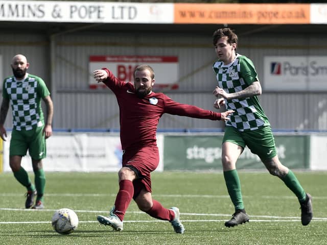 Burrfields' Craig Ball (maroon) in action during his side's Mid-Solent League loss to Mob Albion at Westleigh Park.
Picture: Allan Hutchings