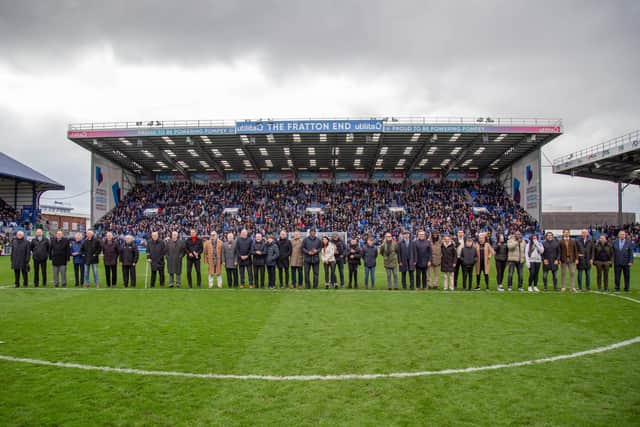 The photo of the day. All the Pompey players come together on the pitch at half-time in front of the Fratton End.