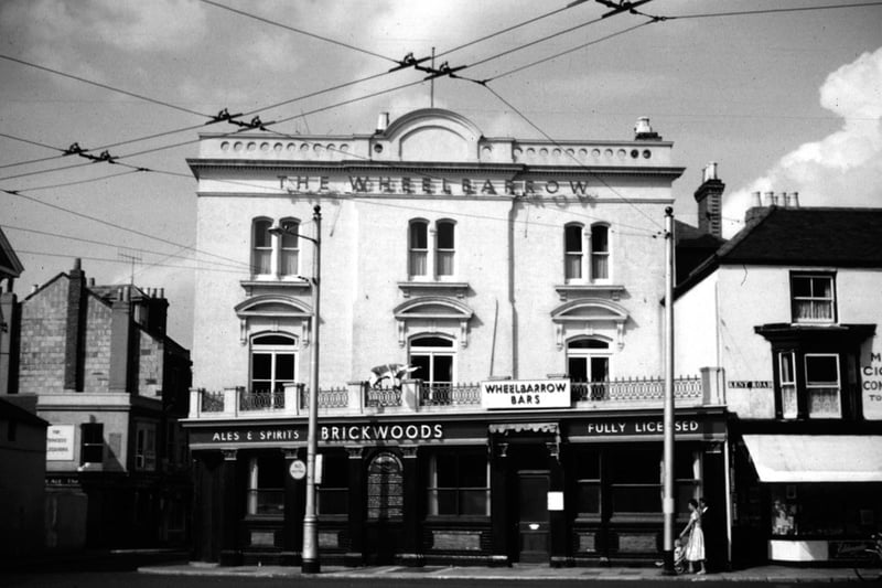 The cat's cradle of trolley bus wires outside The Wheelbarrow pub at 1 Kent Road, Southsea, Portsmouth in 1960