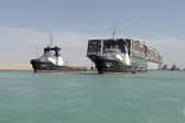 A picture released by Egypt's Suez Canal Authority on March 29, 2021, shows a tugboat pulling the Panama-flagged MV 'Ever Given' container ship after it was fully dislodged from the banks of the Suez. (Photo by - / SUEZ CANAL AUTHORITY / AFP) (Photo by -/SUEZ CANAL AUTHORITY/AFP via Getty Images)