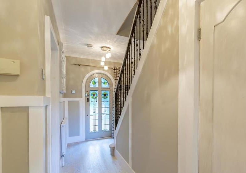 The welcoming hallway leads to the main rooms on the ground floor. It has a central-heating radiator, a window to the front and wooden plantation shutters.