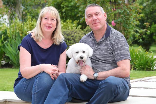 Chris Jones is 'concerned' that Fareham Borough Council are planning to use a weed killer containing glyphosate, which may have poisoned his dog Teddy last summer. Pictured: Chris and Sue Jones with their dog Teddy, June 2021. Picture: Stuart Martin (220421-7042).