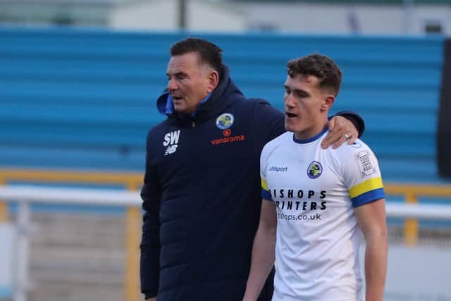 Paul Doswell, left, puts his arm around a glum-looking Alfy Whittingham Picture: Dave Haines