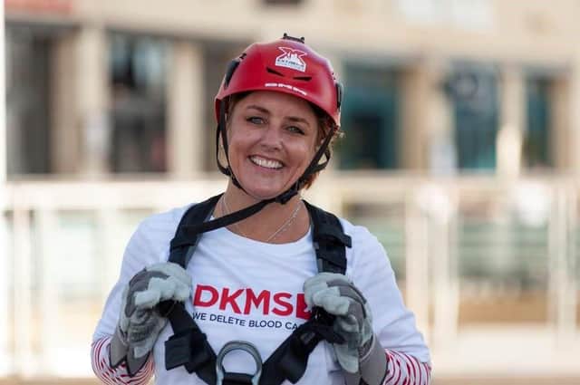 Sally Hurman, 49, after completing her 170 metre charity abseil of the Spinnaker Tower.
Photograph: Morten Watkins/PA Wire