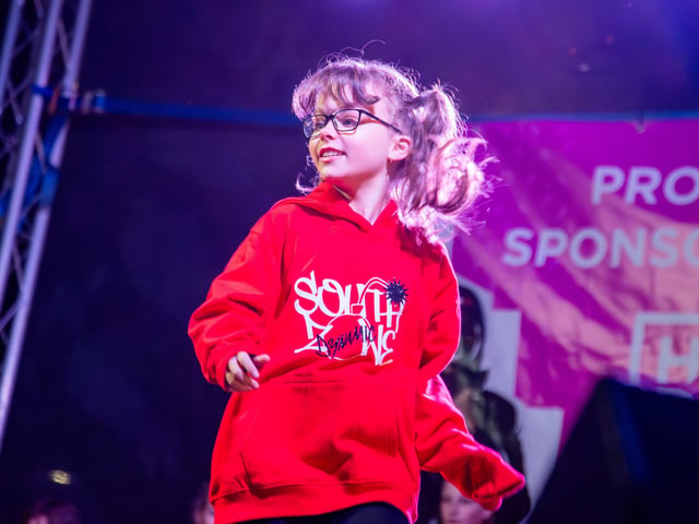 Hundreds of residents descended on Commercial Road to watch local dance troops and celebrities come together to turn on the Christmas lights.
Pictured - South Zone Dancers
Photos by Alex Shute