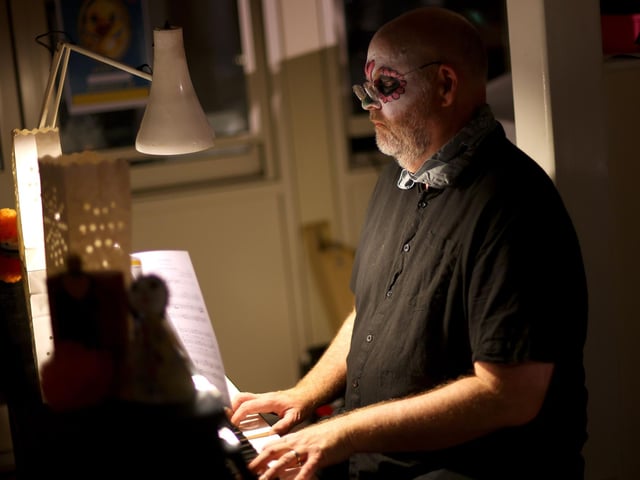 Director of Music, Mr George Tinsley, plays to a packed audience