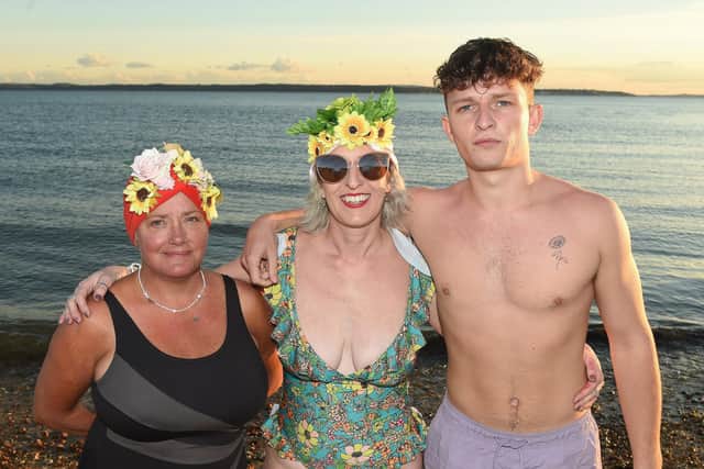 Sam Hope (43) from Lee-on-the-Solent, Elin's boyfriend of three years' mum, is now raising money for Lepra UK in memory of Elin by taking a dip in the ocean every day for a year. Her 200th dip took place on Friday, September 16, at Hill Head beach.
Pictured is: (middle) Sam Hope with Elin's mum Deryn Martin and her son and Elin's boyfriend Ethan Hope.
Picture: Sarah Standing (160922-3381)
