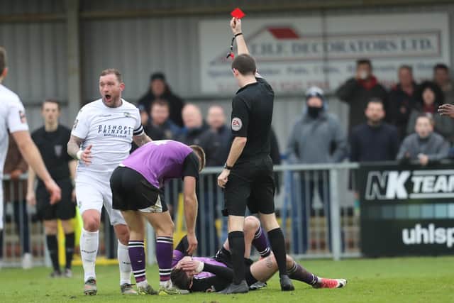 Danny Kedwell is devastated by the red card shown to him by referee Jack Packman. Photo by Dave Haines.
