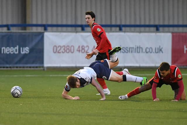 Tommy Wright  is fouled during Hawks' loss to Eastbourne Borough. Picture: Neil Marshall