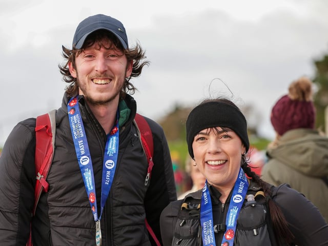 Friends, Alex Anderson and Megan Hall, from Portsmouth, were pleased with their times in the half marathon "considering the cold and the wind."  Picture: Chris  Moorhouse (221224-90)