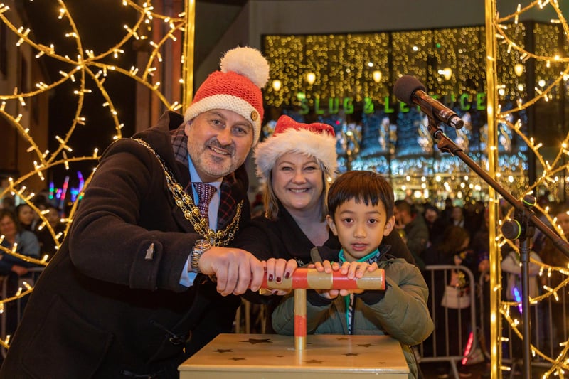 The Worship Mayor of Fareham councillor Fred Birkett with Mayoress Lisa Birkett and art competition winner Quinton Fok (7) launch the Fareham Christmas lights. Picture: Mike Cooter (181123)