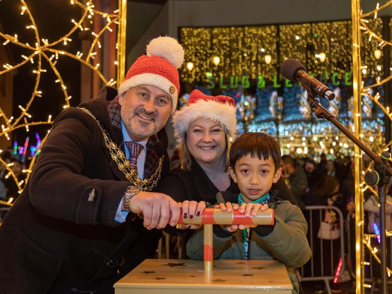 The Worship Mayor of Fareham councillor Fred Birkett with Mayoress Lisa Birkett and art competition winner Quinton Fok (7) launch the Fareham Christmas lights. Picture: Mike Cooter (181123)
