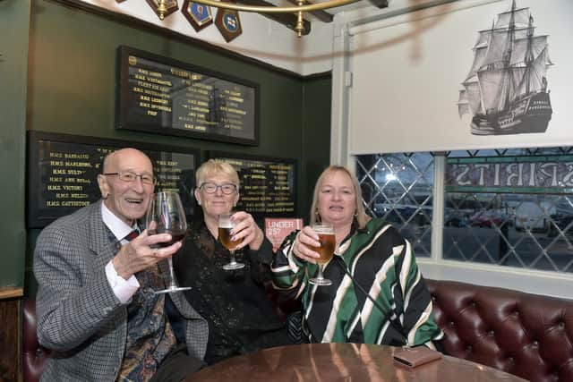 From left, John Thurston, Tina Willett and Cindy Hills, all from Portsea at The Ship Anson on The Hard on its reopening night 
Picture: Sarah Standing (170223-9742)
