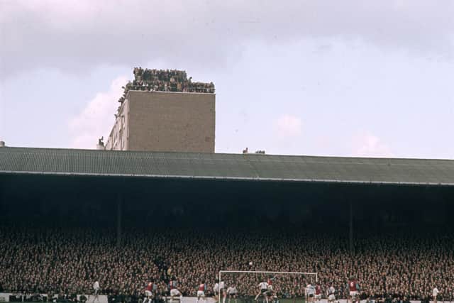Fans on the roof of a tower block watching West Ham's FA Cup replay with Hereford United in 1972. Photo by A. Jones/Express/Getty Images.