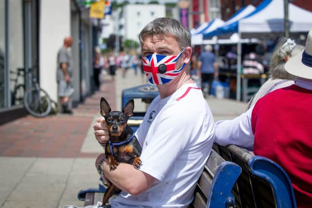Tony Watson with his dog, Muki, in Cosham High Street. Picture: Habibur Rahman