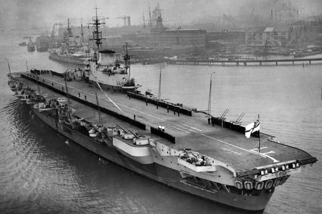 The ship's company lines the deck of the Implacable-class aircraft carrier HMS Indefatigable as she returns to Portsmouth after service in the Far East, March 16, 1946. Picture: Central Press/Getty.