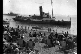 The paddle steamer Merstone is admired by holidaymakers on Southsea beach between the wars