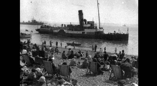 The paddle steamer Merstone is admired by holidaymakers on Southsea beach between the wars