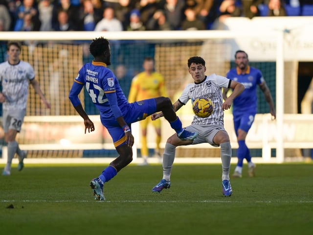 Pompey's Alex Robertson tries to block Shrewsbury's Nohan Kenneh. Picture: Jason Brown/ProSportsImages