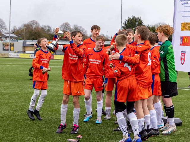 Denmead Youth Lions celebrate winning the Under-13 Truman Challenge Cup. Picture: Mike Cooter