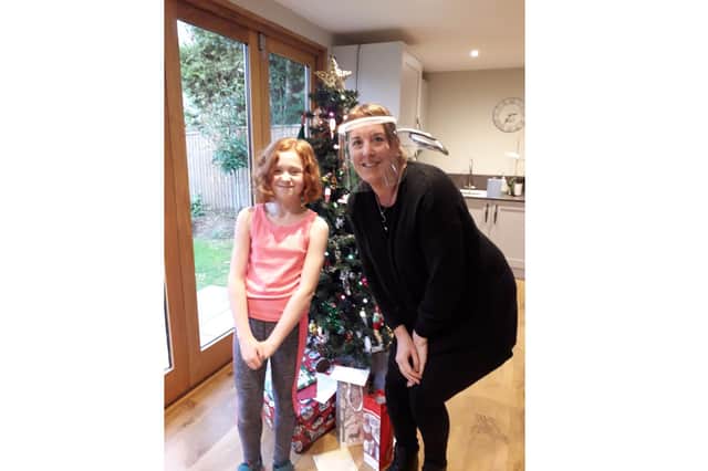 Lily Torah, 10 from Cowplain, had her hair cut short for the Little Princess Trust and raised more than £1,000. Pictured: Lily with her hairdresser Claire