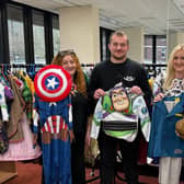 Karen Cray, Jakob Philbrick and Helen Morton of HIVE Portsmouth. The charity has been collecting costumes to hand out to families for World Book Day.