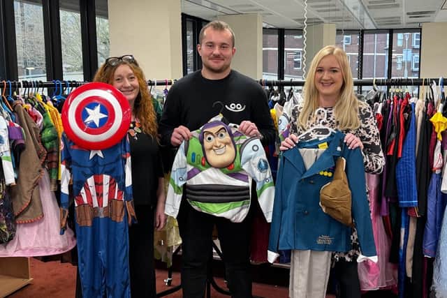 Karen Cray, Jakob Philbrick and Helen Morton of HIVE Portsmouth. The charity has been collecting costumes to hand out to families for World Book Day.