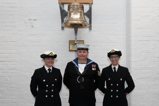 Lt Sumner, AB Hodgson, SLt Bull beneath the ships bell.
Picture: Keith Woodland (231021-137)