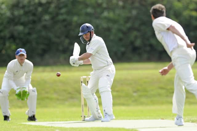 Portsmouth Community's Matt Davies about to score runs off this delivery from Waterlooville 2nds' Will Chrystal. Picture Ian Hargreaves