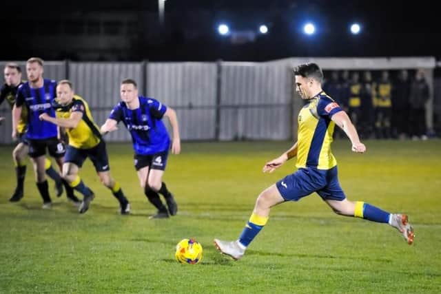 Joe Briggs scores the first of his hat-trick against Clanfield from the penalty spot. Picture: Dave Bodymore.