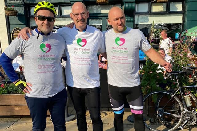 Jason and two of his fellow cycling fundraisers at the Ship Anson on The Hard