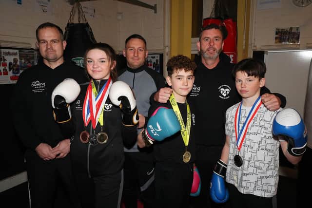 Boxers from Heart of Portsmouth Boxing Academy with their coaches.  Ruby Waters and Alfie Holman won their categories at the national MTK Cup in Penrith, while John Boy Doran, front right, was a national finalist. Coaches (from left) are Dave Johnston, Lee Theobald and George Smith.
Picture: Stuart Martin