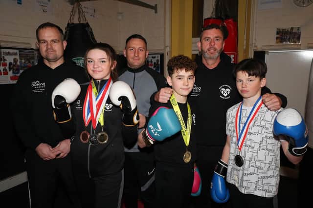 Boxers from Heart of Portsmouth Boxing Academy with their coaches.  Ruby Waters and Alfie Holman won their categories at the national MTK Cup in Penrith, while John Boy Doran, front right, was a national finalist. Coaches (from left) are Dave Johnston, Lee Theobald and George Smith.
Picture: Stuart Martin