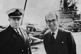 Defence Secretary John Nott with the captain of HMS Hermes, Capt Lyn Middleton, RN, pictured at the top of the Harrier jet ski-ramp at the bow of the aircraft carrier during the minister’s visit to Portsmouth Naval Base