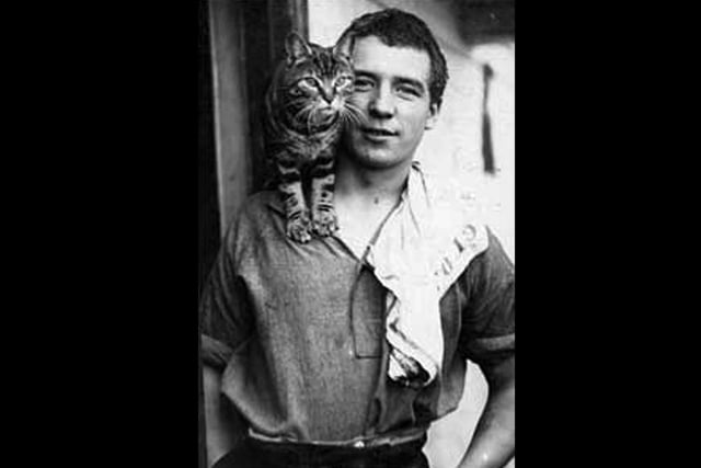 Perce Blackburow with Mrs Chippy. She was ship's cat on the 1914 Endurance expeditionMrs Chippy enjoys a ride on Endurance crewmember Perce Blackborow's shoulder Picture: SPRI