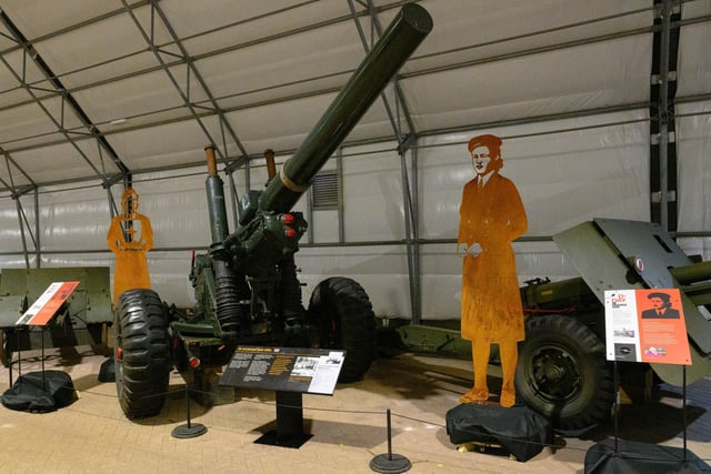 Pictured is: Two of the figures at the display
Picture: Keith Woodland (260521-45)