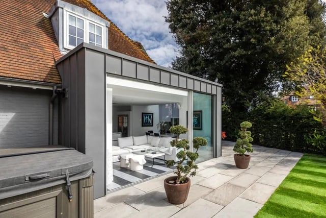 This property comes with ten bedrooms, eight bathrooms and five reception rooms as well as a huge garden.