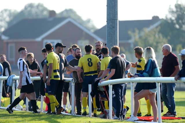 Words are exchanged on the touchline between players and spectators at Hayling v Paulsgrove. Picture: Chris Moorhouse