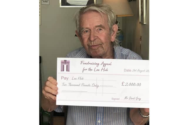 Lee-on-the-Solent resident David Gray has donated £2,000 to help the closed library in the area be turned into Lee Hub. Pictured: David Gray with a ceremonial cheque